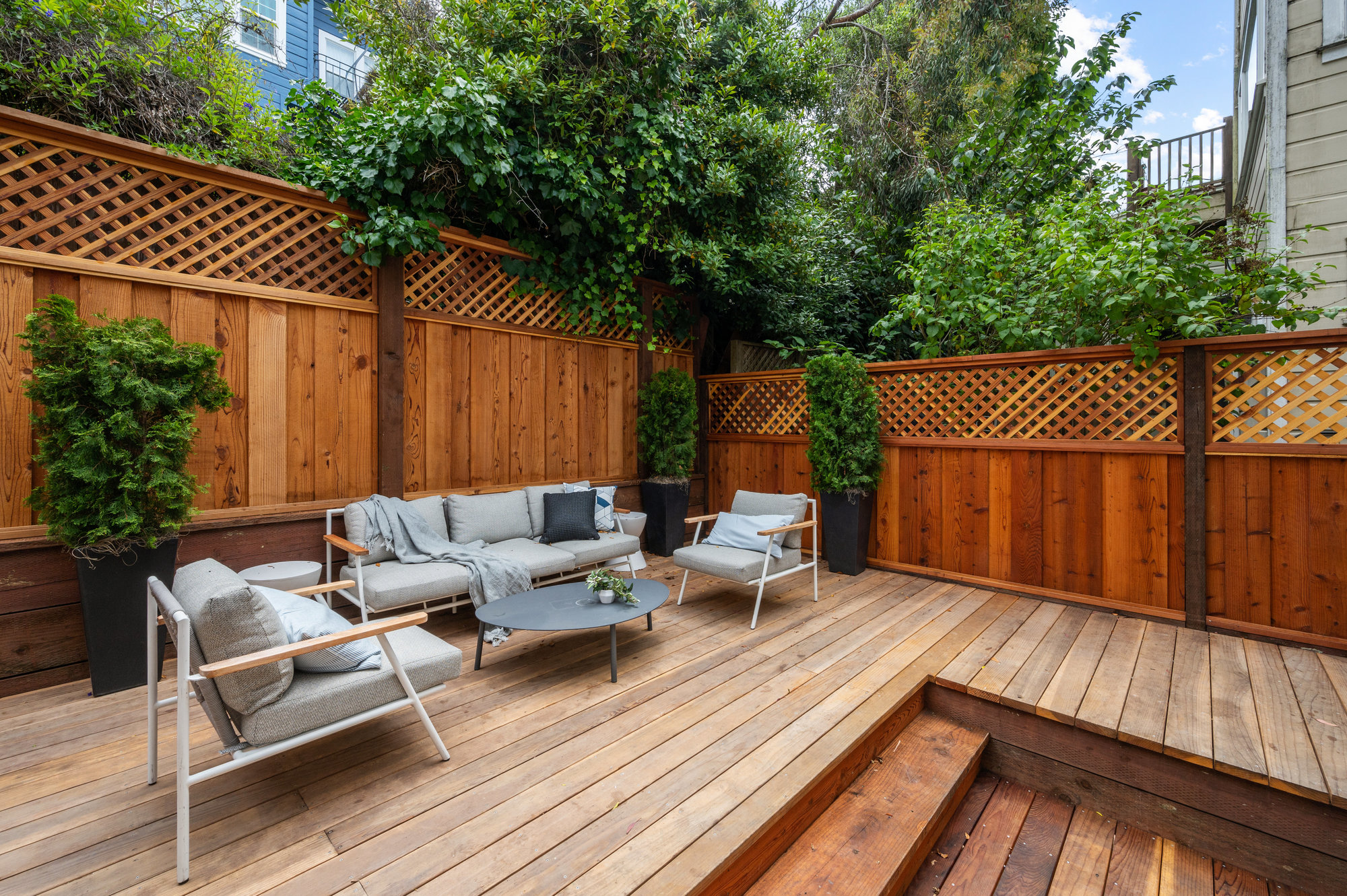 Property Photo: Large outdoor wooden deck. 