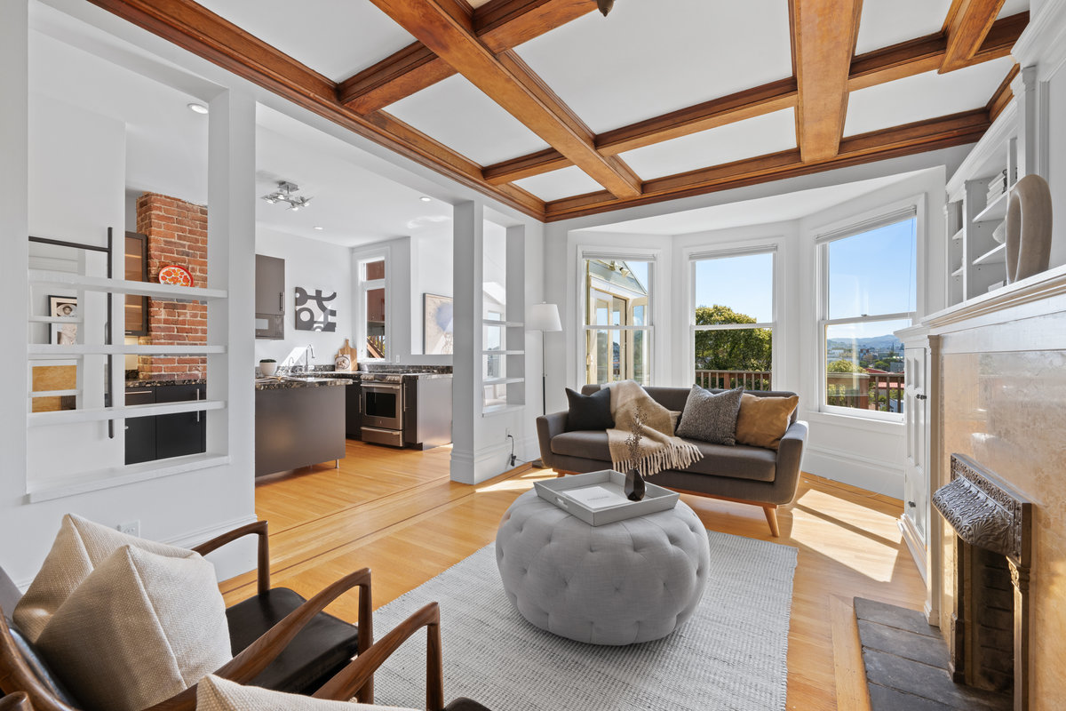 Back living room with stunning beam details.