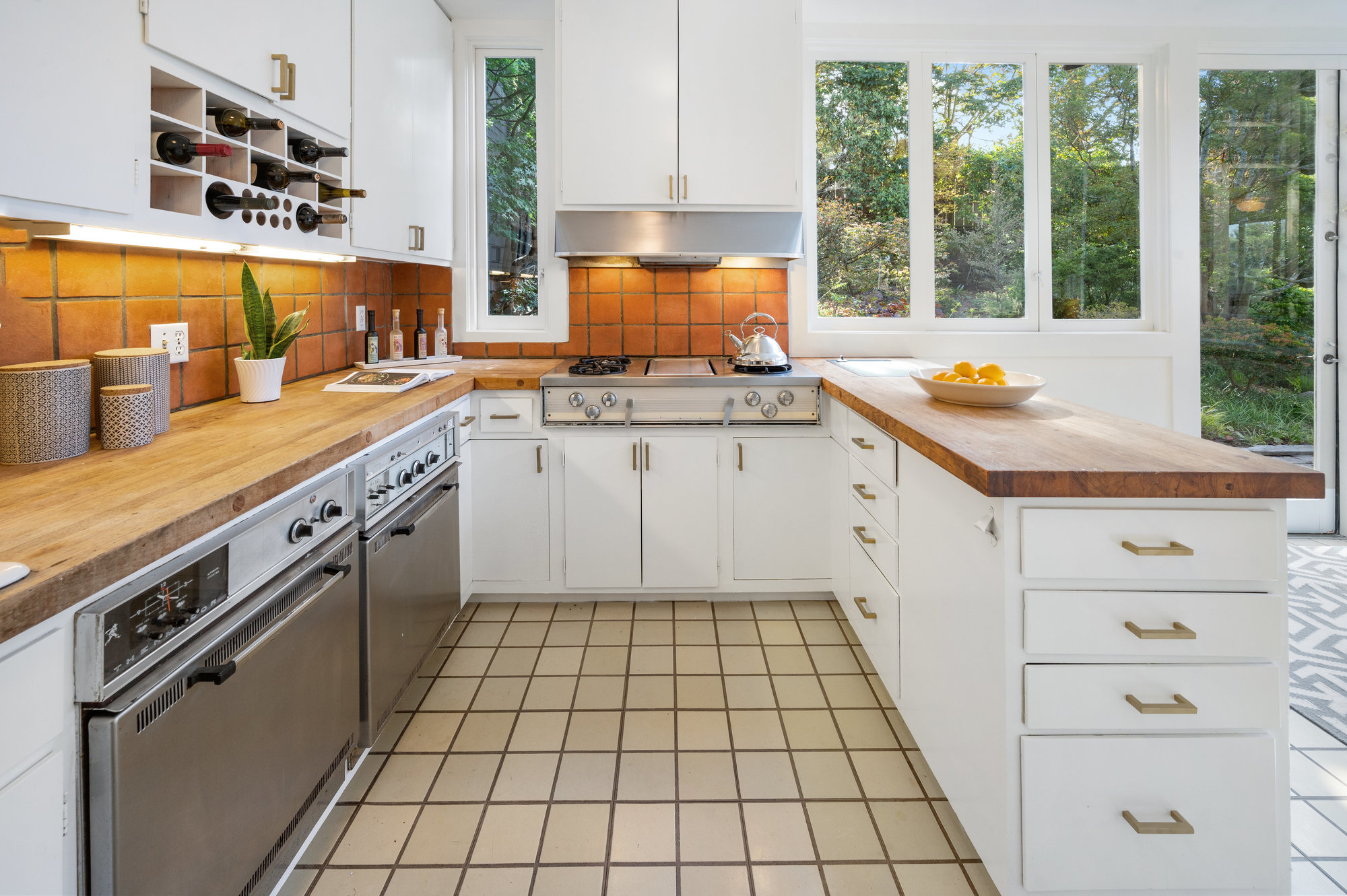 View of the kitchen, featuring wooden counter-tops