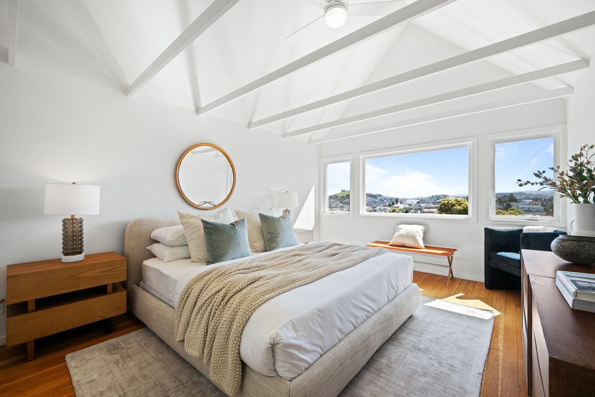 Primary bedroom has stunning views and beautiful vault ceilings. 