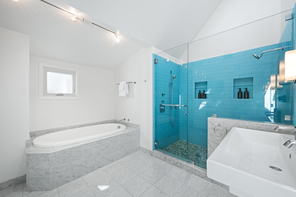Primary bathroom with stunning blue tile shower