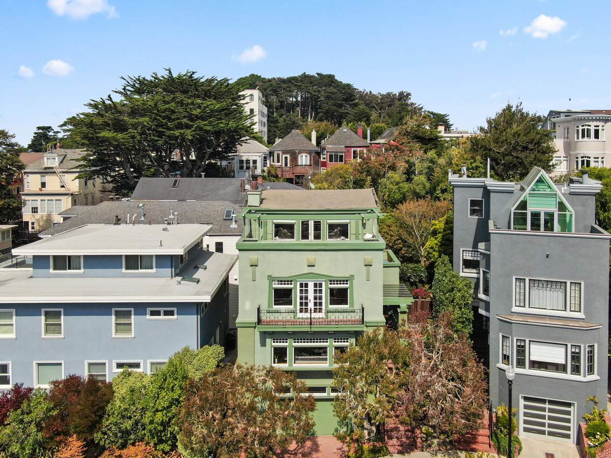 Front exterior view of 4 Ashbury Terrace in San Francisco, showing a Craftsman home with green facade