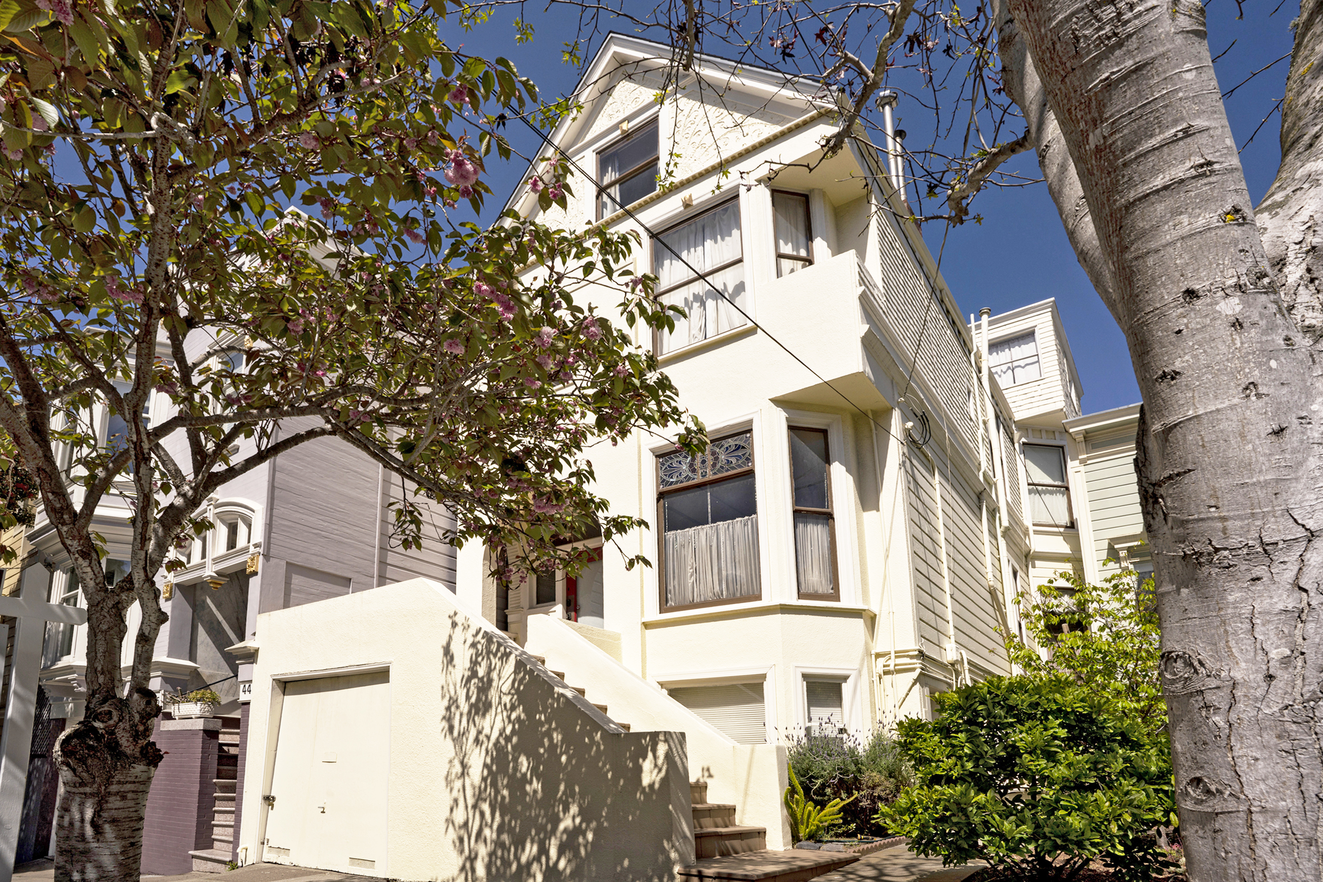 The cream colored facade of 38 Lyon Street