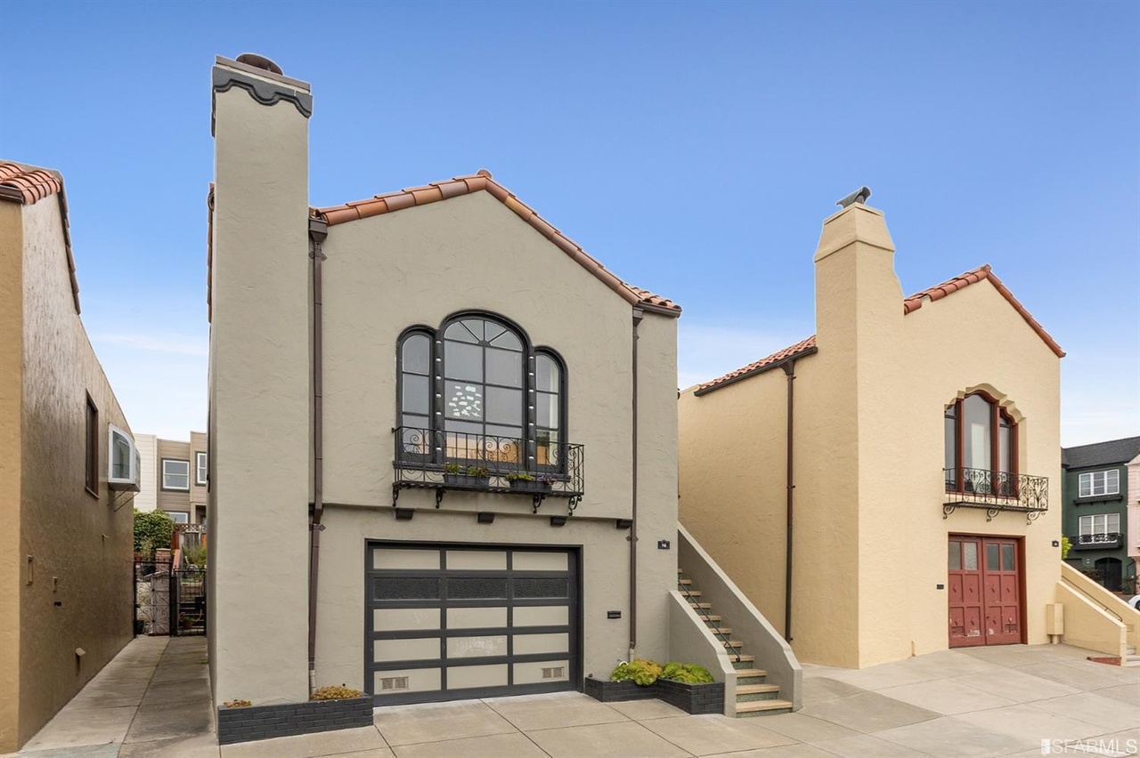 Font exterior view of 50 Willard North, showing a home with tan Stucco facade