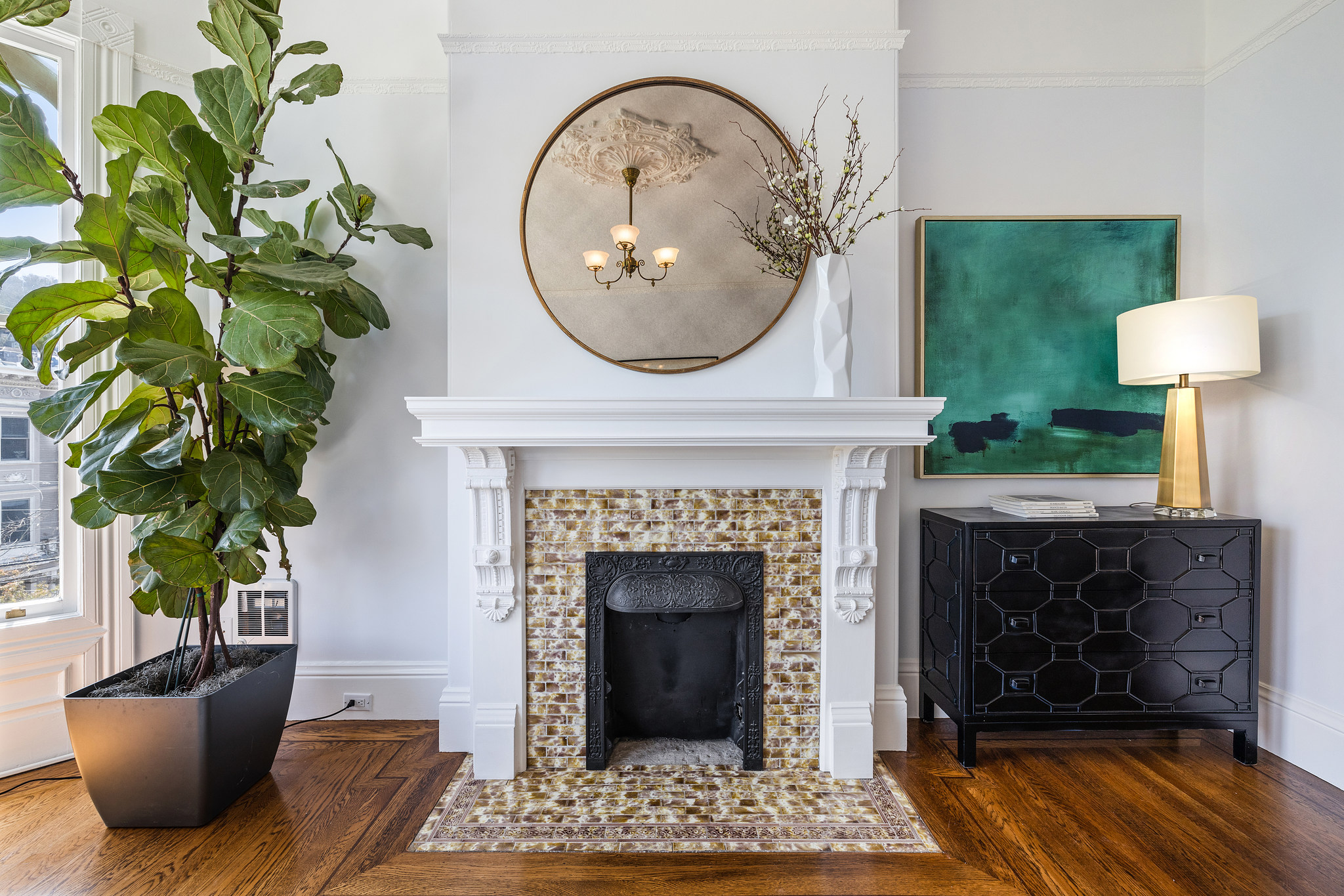 A beautiful tiled fireplace featured in 454 Frederick Street
