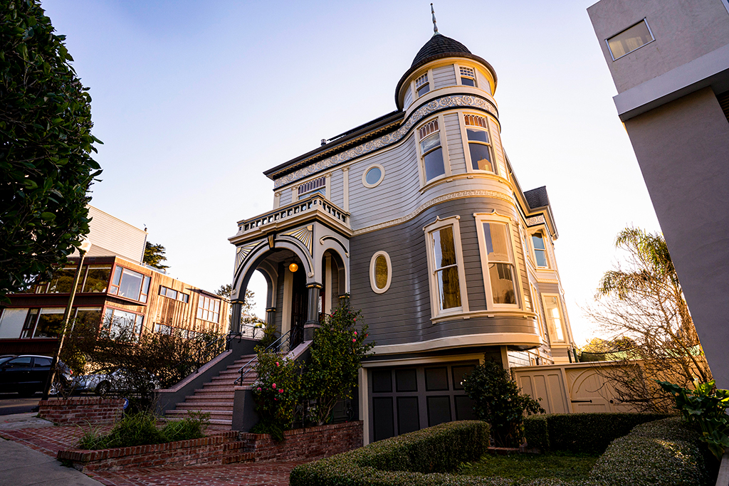 View of a grand Victorian home with turret 