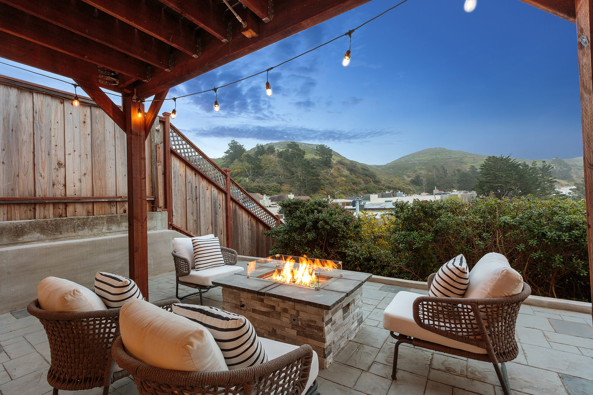 A roaring fire and view of the sky as seen from the deck of 42 Clairview