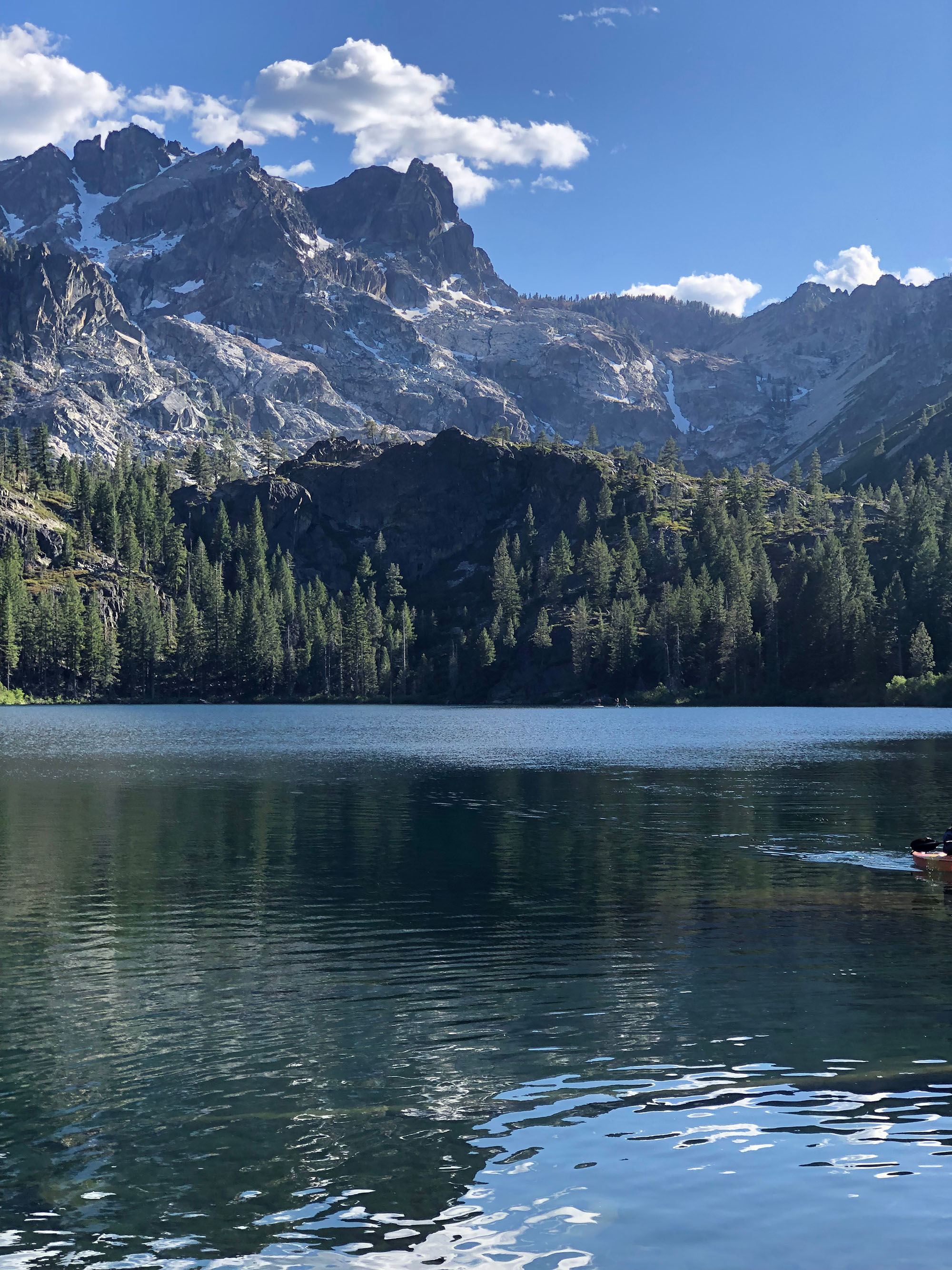 Nature view of mountains, trees, and a lake near Lakes Basin, CA