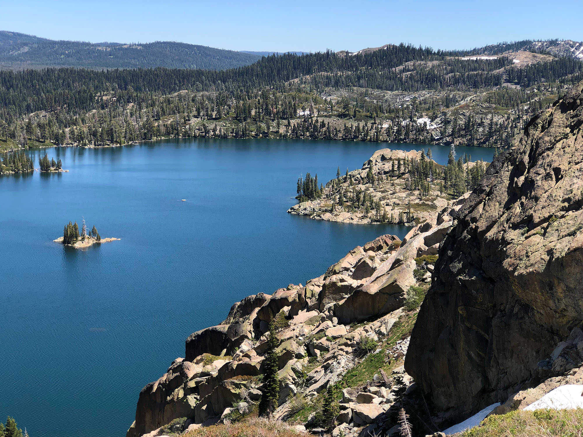 View of rock cliffs with a lake below