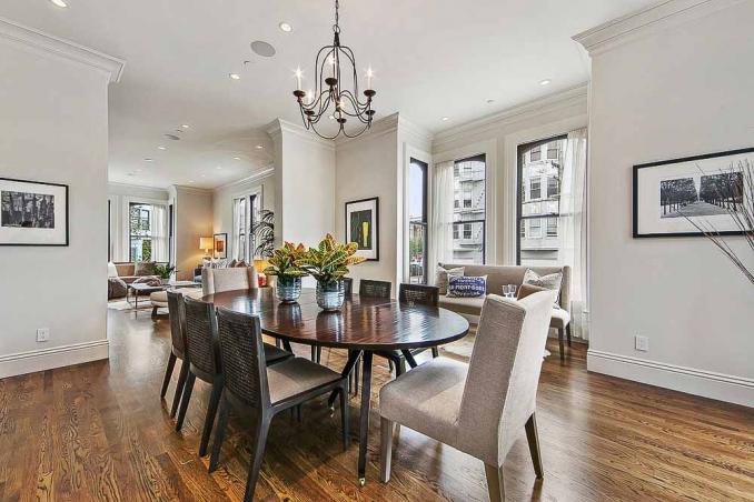 Property Thumbnail: Dining area with chandelier and wood floors