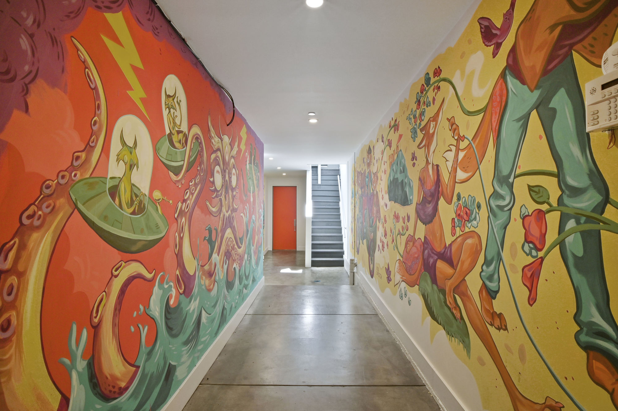Property Photo: View of the hall leading to 45-49 Belcher Street, featuring walls with colorful painted art-work