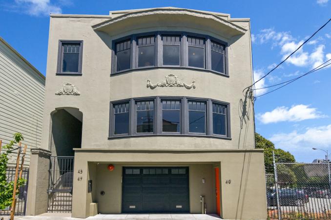 Property Thumbnail: Front exterior view of 45-49 Belcher Street, featuring a tan facade