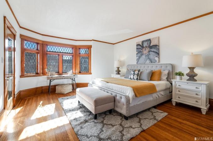 Property Thumbnail: Bedroom two, showing wood floors and large bay windows