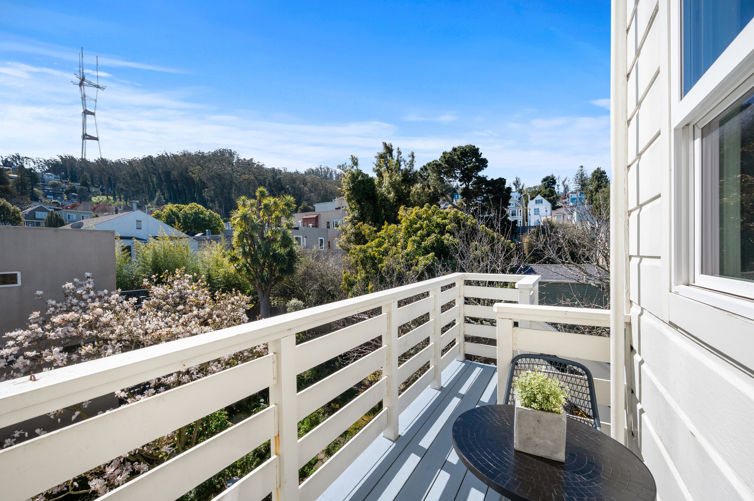 Property Photo: Deck with a sitting area and sweeping views of Cole Valley and Sutro Tower