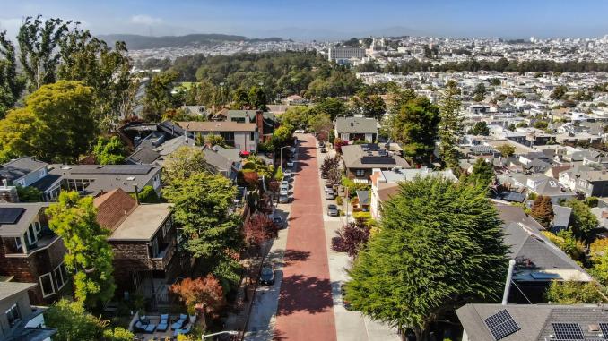 Property Thumbnail: Aerial photo of the stunning Edgewood neighborhood. Large homes and trees decorate this street. 