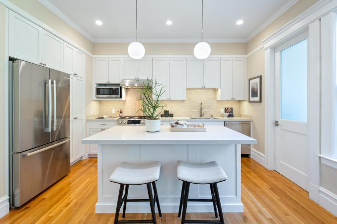 Property Thumbnail: Kitchen has island with two stools. 
