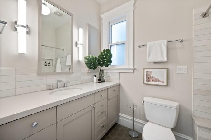 Property Thumbnail: Bathroom with large vanity w/ one sink. Lots of light tones. 
