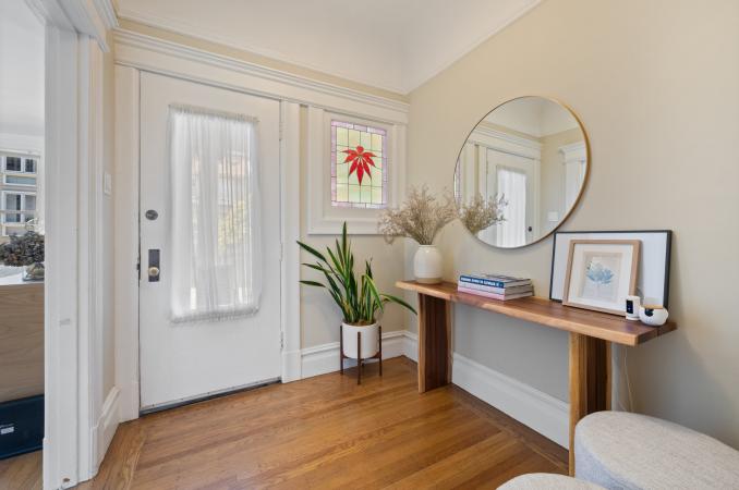 Property Thumbnail: Entryway of 638. Harwood floors and a beautiful stain glass window next to entry door. 