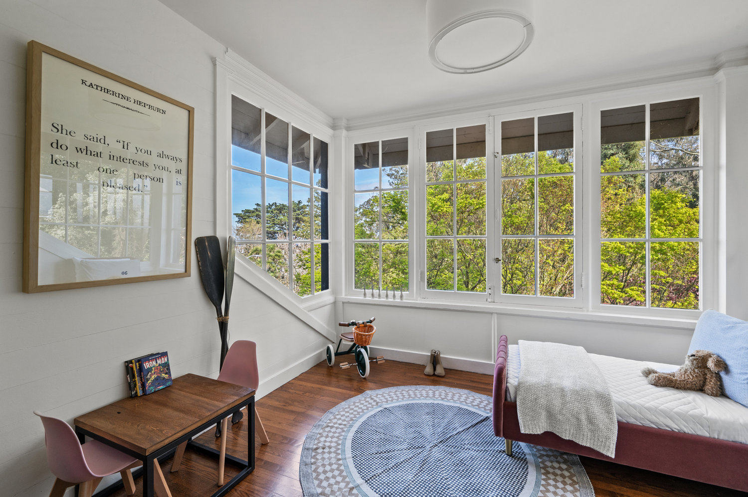 Property Photo: Guest room that is staged as a children's room. Harwood floors with nice large windows that look out onto Edgewood. 