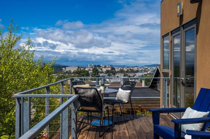 Property Thumbnail: Beautiful view off the back deck. Greenery to the left and looking over cole valley.