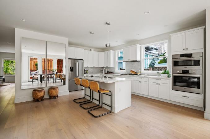 Property Thumbnail: Looking into kitchen from dining space. Large open space.