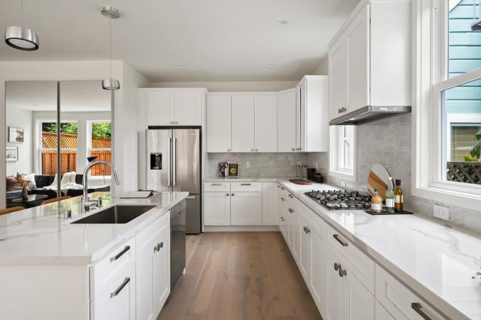 Property Thumbnail: Looking down between the island and counter. The sink and dishwasher are in/on island. There are also lower cabinets. 