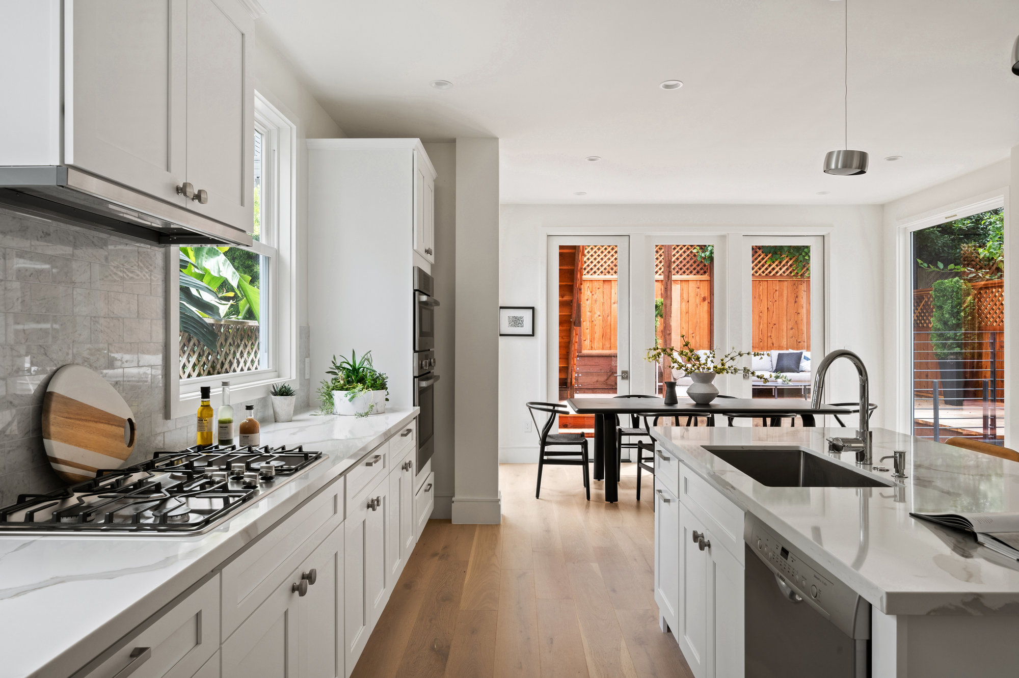 Property Photo: Looking over kitchen to the dining space. 