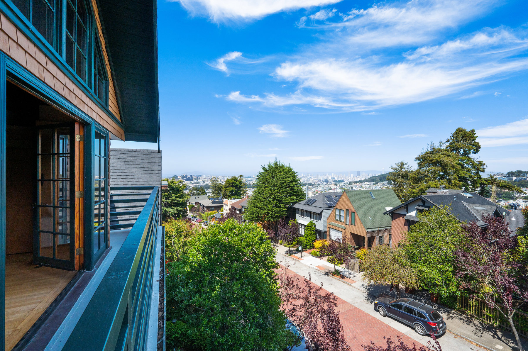 Property Photo: View from the upper balcony looking over Edgewood Ave and San Francisco Bay beyond