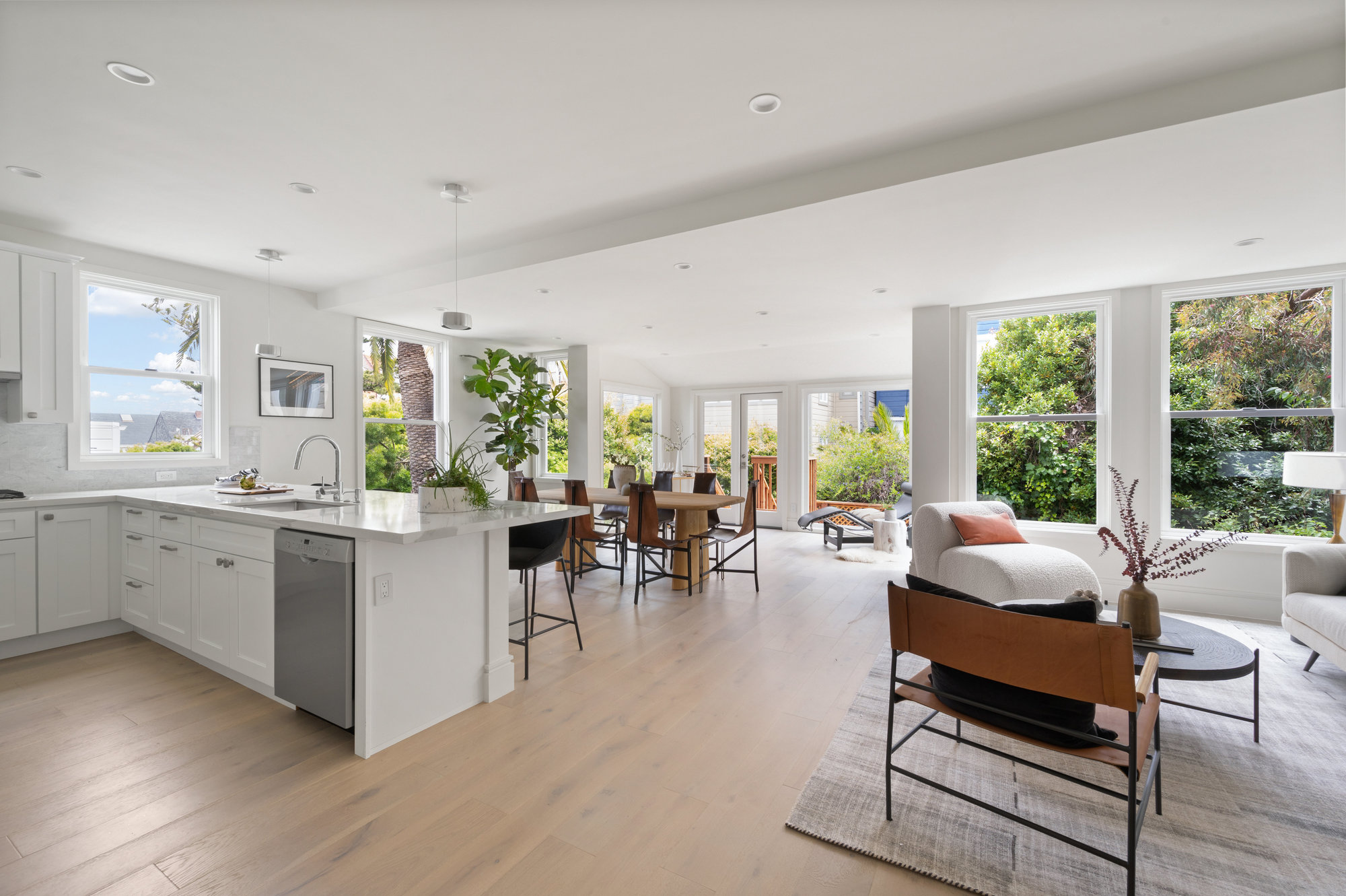 Property Photo: There is an island that has seating with sink and dishwasher. 