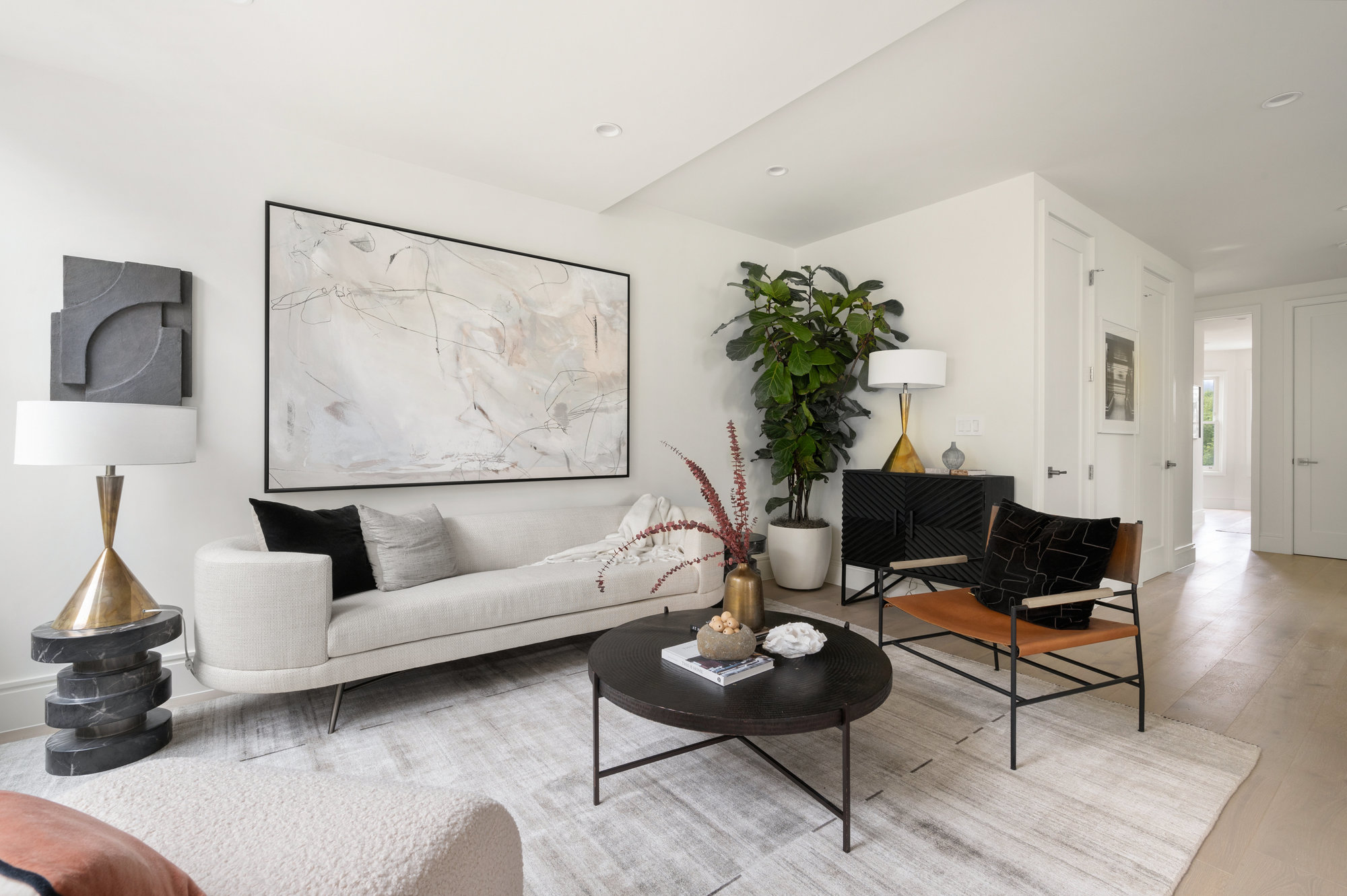 Property Photo: Looking over living room and you can see the main entry in the backside corner. 