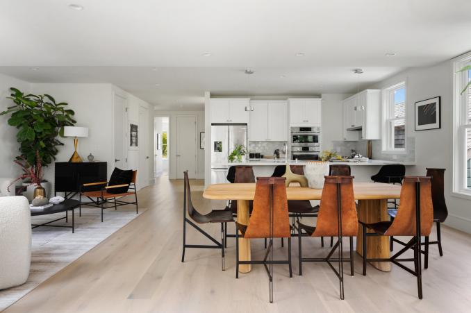 Property Thumbnail: Looking at dining area with the kitchen in the back round. 