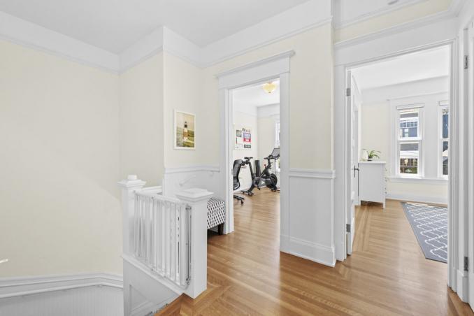 Property Thumbnail: At top of the stairs at entryway looking at bedroom and office doorway.