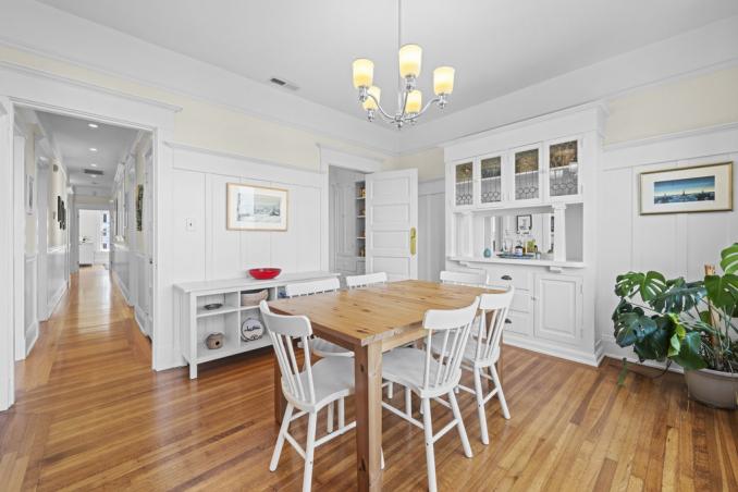 Property Thumbnail: Looking over dining room towards the front of the home. Hardwood floors throughout. 