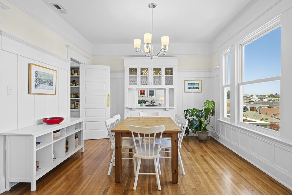 Property Photo: Dining room has lots of molding details and stunning built in. 