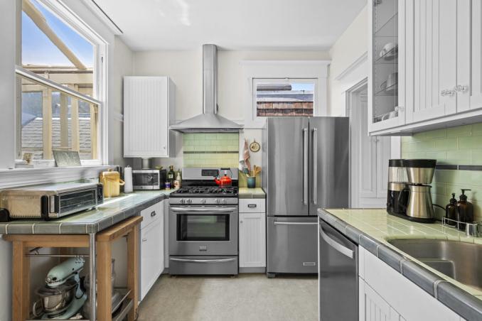 Property Thumbnail: Kitchen has updated stainless steel appliances, with beautiful tile backsplashes and countertops. 