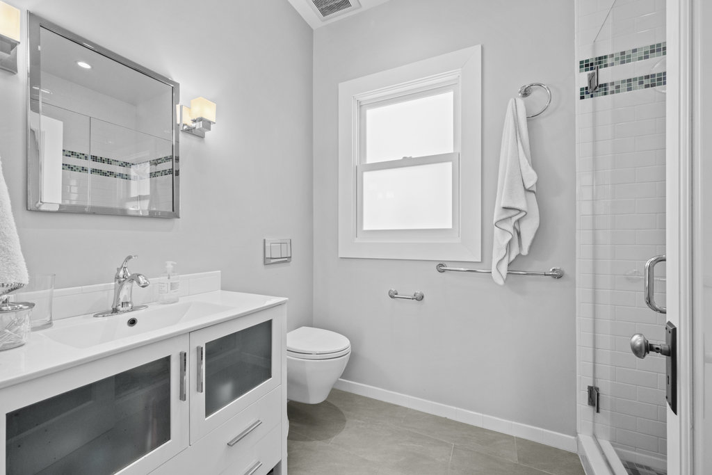 Property Photo: The on suite bathroom is all updated with shower, toilet and vanity sink. 