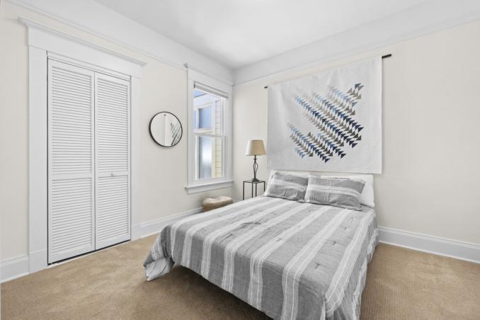 Property Thumbnail: Guest bedroom has full size bed, and there is molding details. 