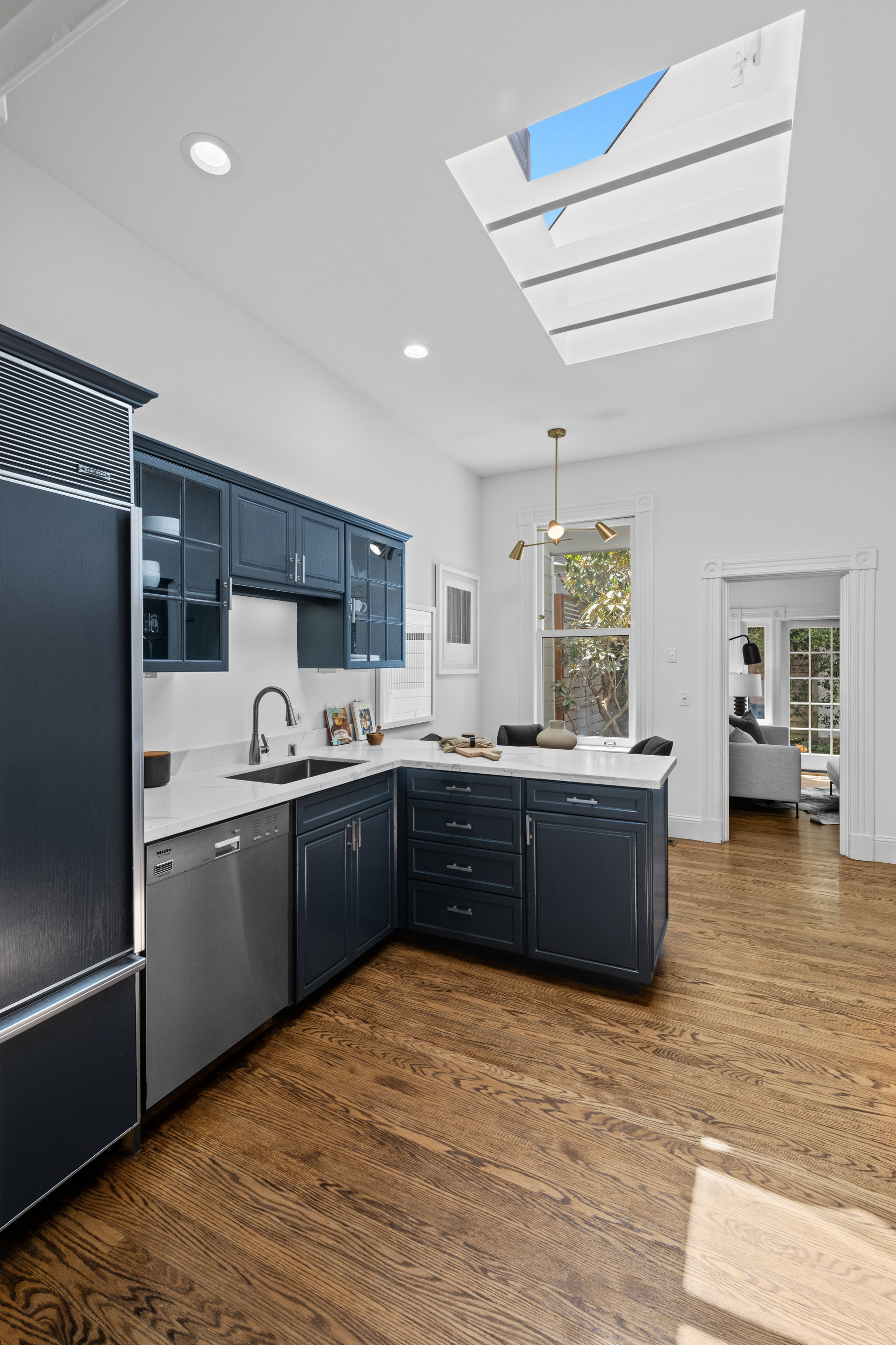 Property Photo: Kitchen has hardwood floors throughout. 