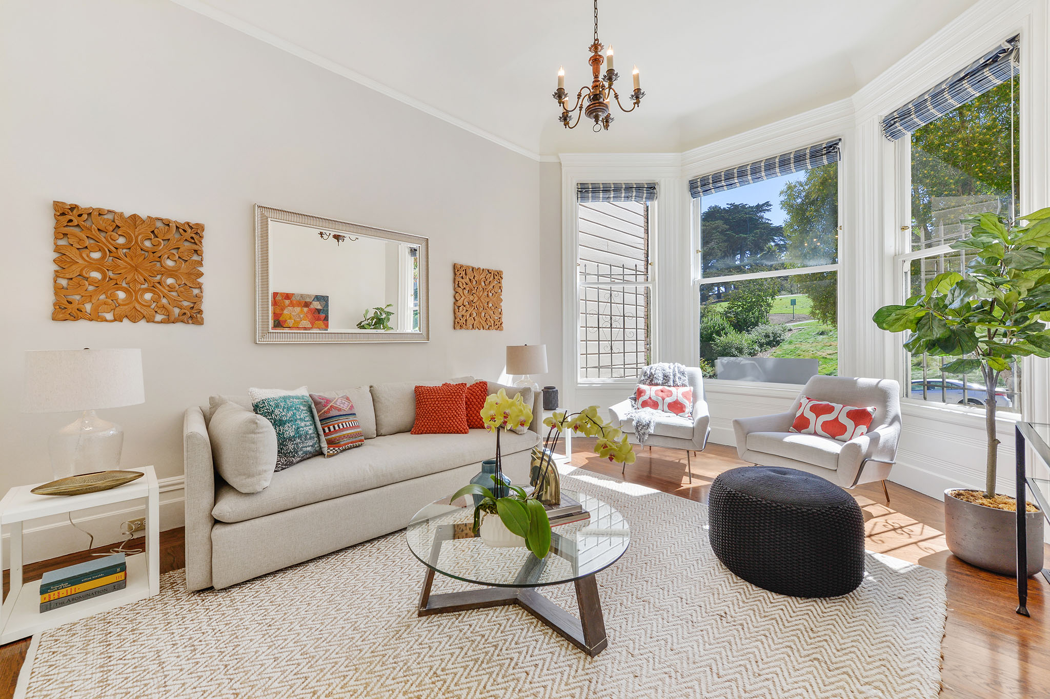 Property Photo: Living room with wood floors and bay window