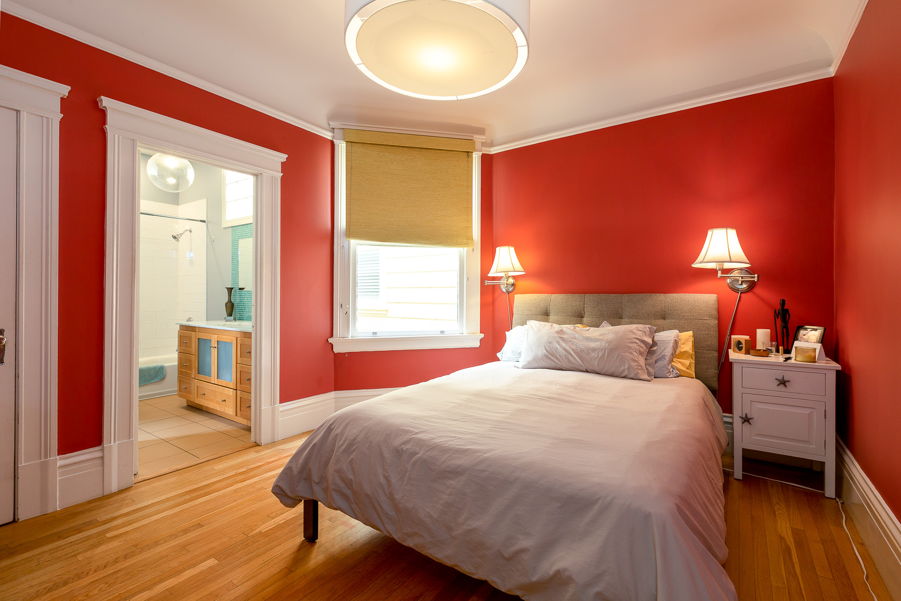 Property Photo: Primary bedroom with on suite bath. 