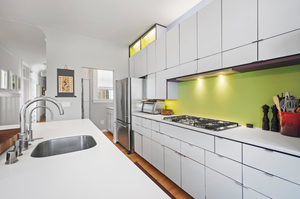 Property Photo: Kitchen has all white cabinets. 