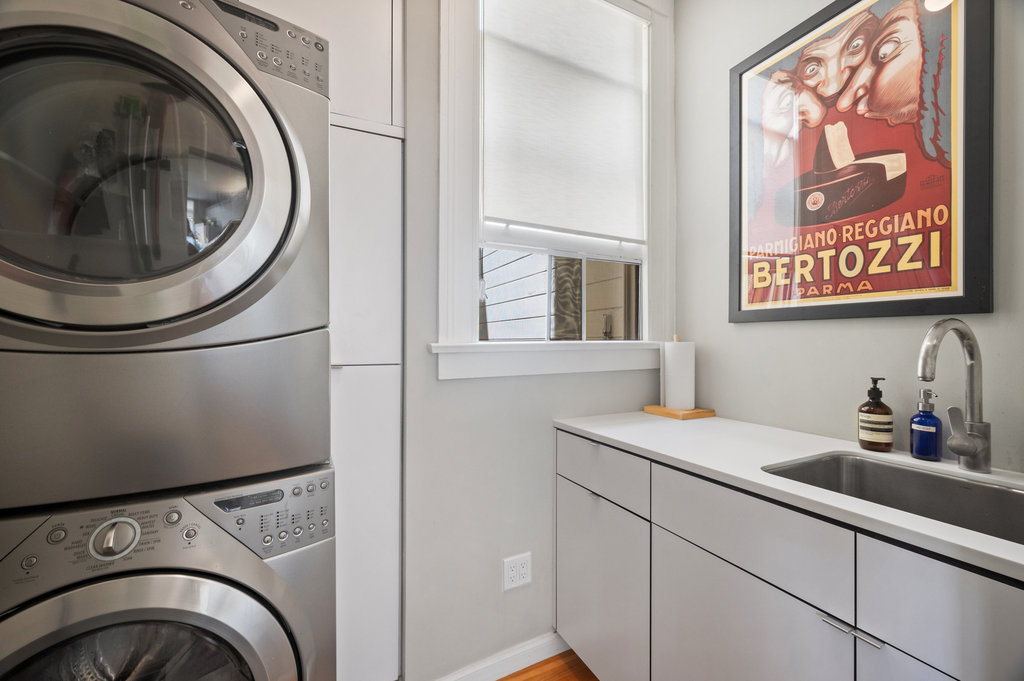 Property Photo: There is a stackable washer & dryer.