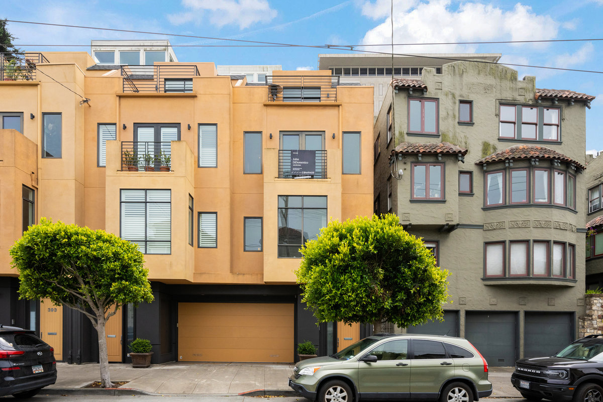 Property Photo: Front exterior of 403 Carl Street. It is a 3 level townhome with lower garage level. 