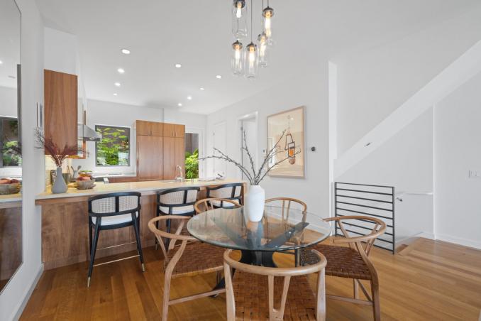 Property Thumbnail: Dining space has a round dining table with 4 chairs. There is additional seating at kitchen counter. 