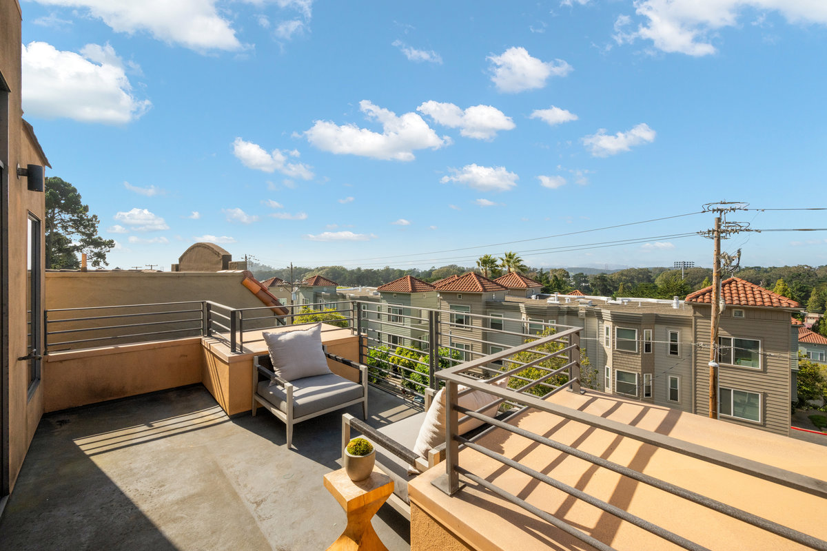 Property Photo: Looking over primary patio looking towards Golden Gate Park. Lots of pretty blue sky. 