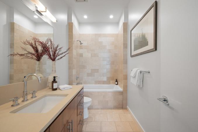 Property Thumbnail: On suite guest bathroom has large vanity and a shower/tub combo.