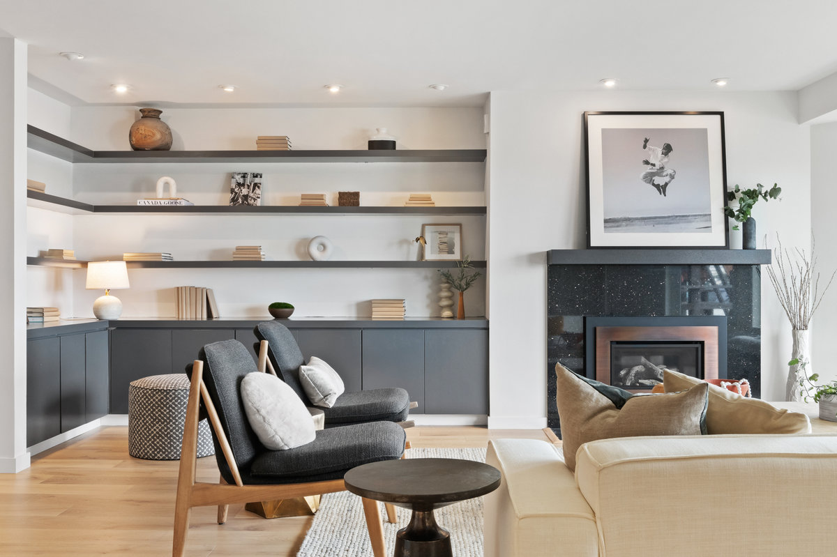 Property Photo: In the corner of the living room there are built in book shelves and lower cabinets.