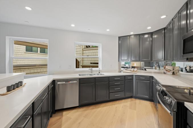 Property Thumbnail: Kitchen sink is right under a window that looking out to courtyard. The dishwasher is right next to sink. 