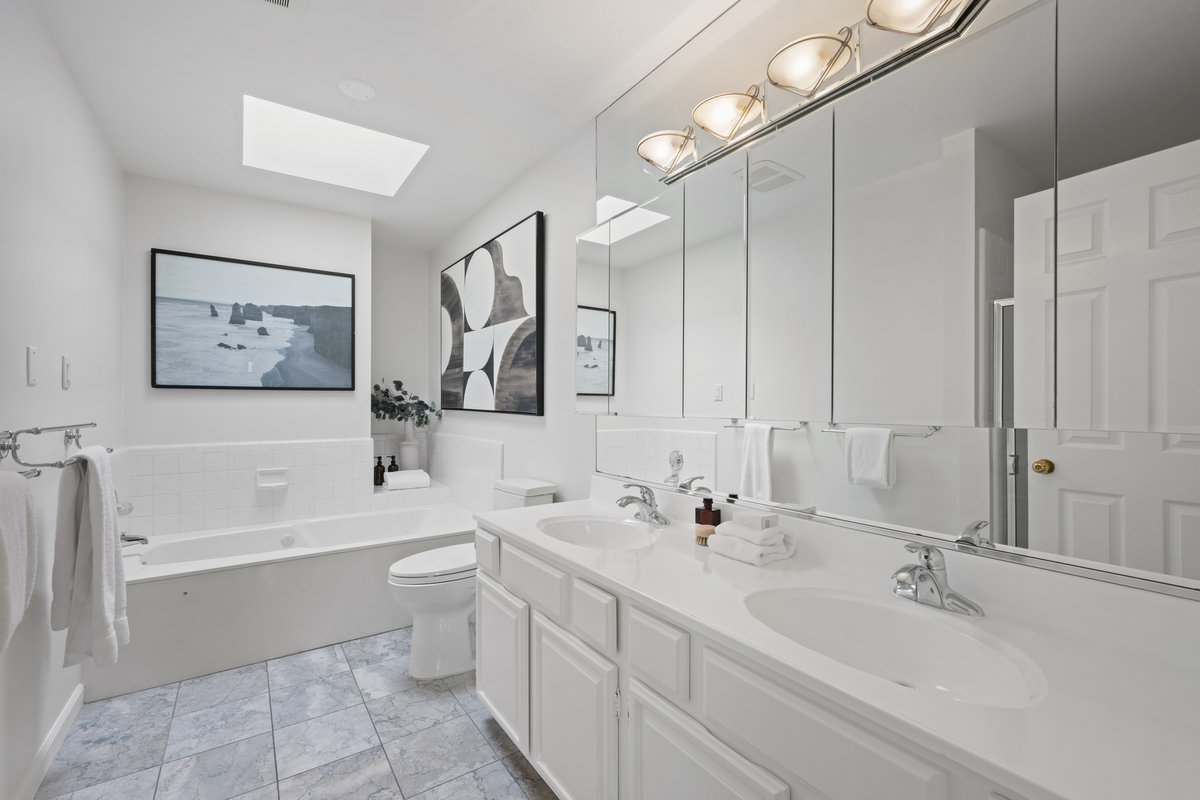 Property Photo: Primary bath bad large double vanity, tub and stand up shower. 