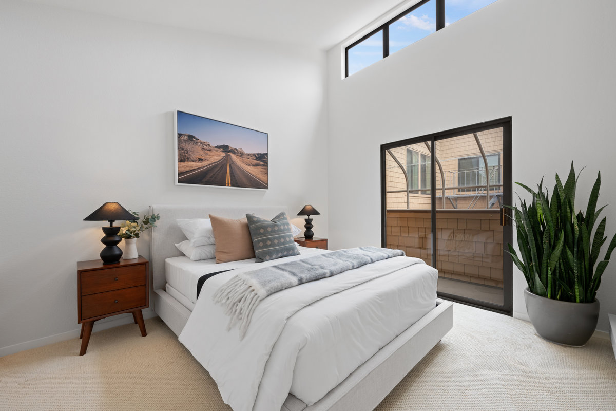 Property Photo: the first guest bedroom has sliding glass doors that open up to patio.